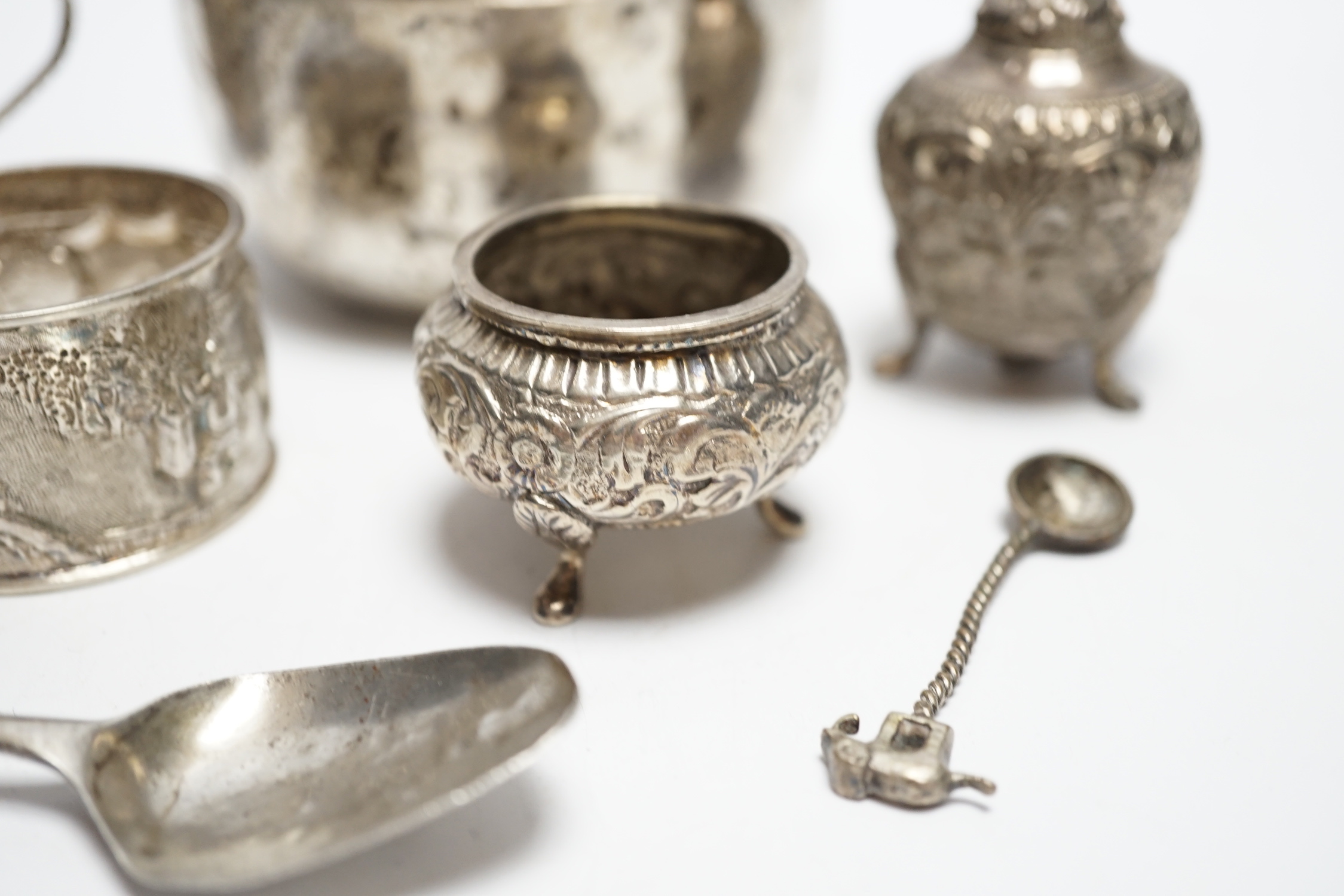 A Thai white metal bowl, diameter 82mm, a Chinese white metal napkin ring, a white metal three piece cruet set and four assorted spoons including George IV teaspoon by William Bateman.